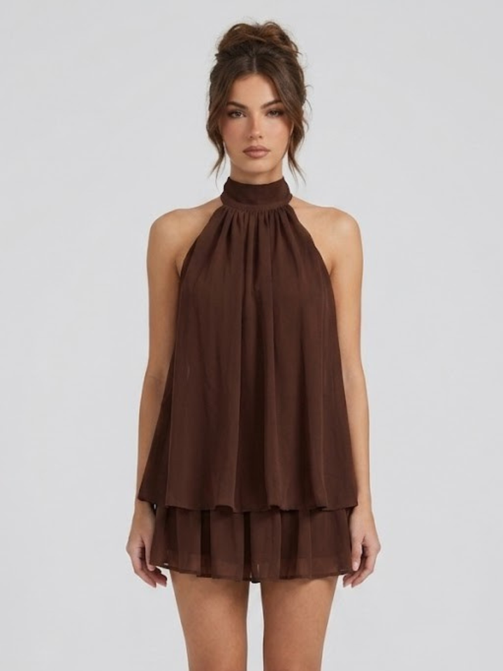 Vestito corto da donna con collo alto all'americana, schiena nuda e volant a balze
