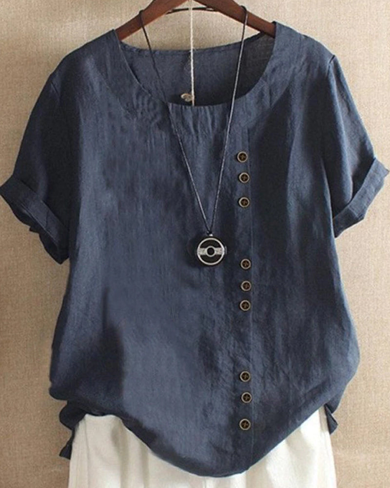 Blusa donna girocollo maniche corte risvoltate abbottonatura asimmetrica vestibilità ampia