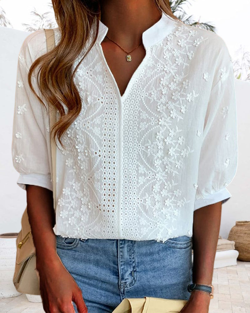 Blusa da donna bianca scollo a V maniche a sbuffo dettagli ricamati