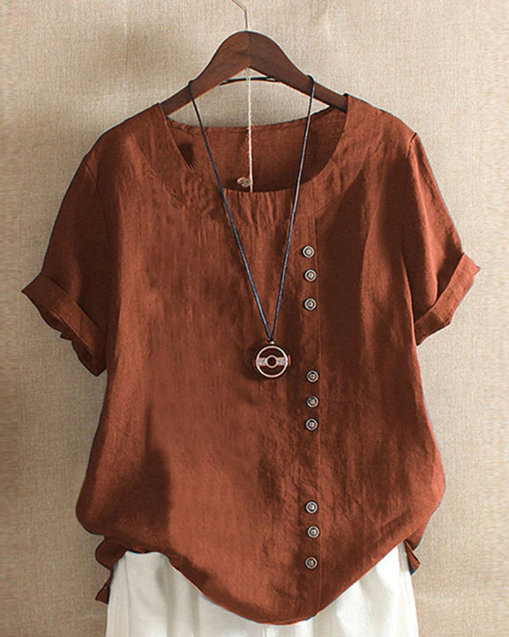 Blusa donna girocollo maniche corte risvoltate abbottonatura asimmetrica vestibilità ampia