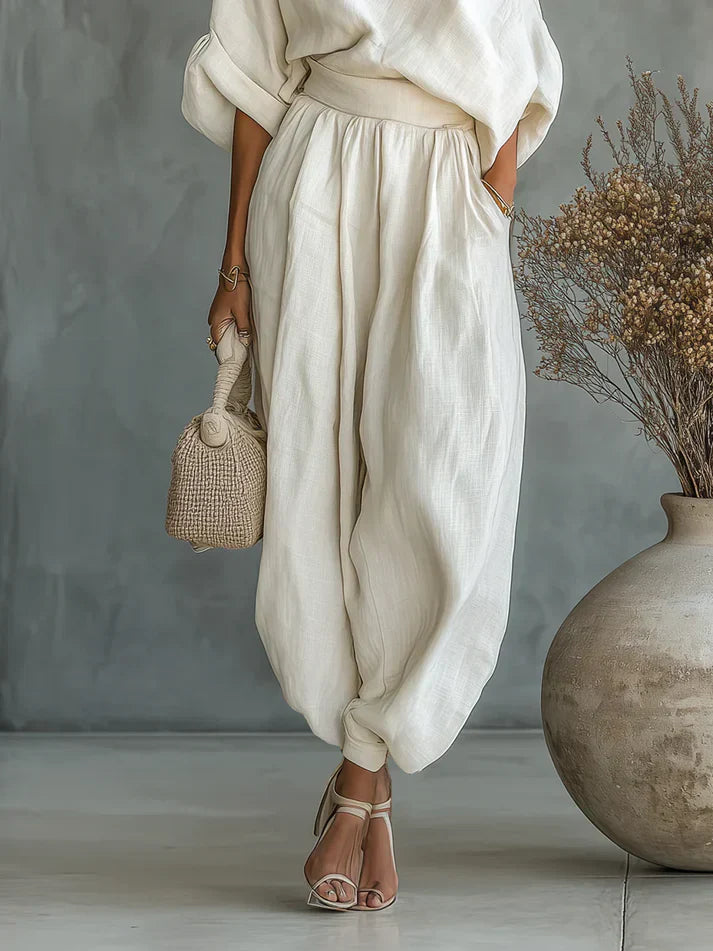 Completo donna écru scollo asimmetrico maniche a sbuffo pantalone sarouel