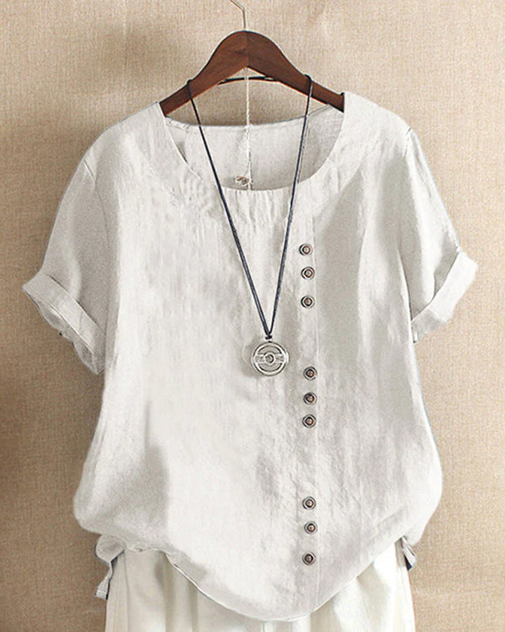 Blusa donna girocollo maniche corte risvoltate abbottonatura asimmetrica vestibilità ampia