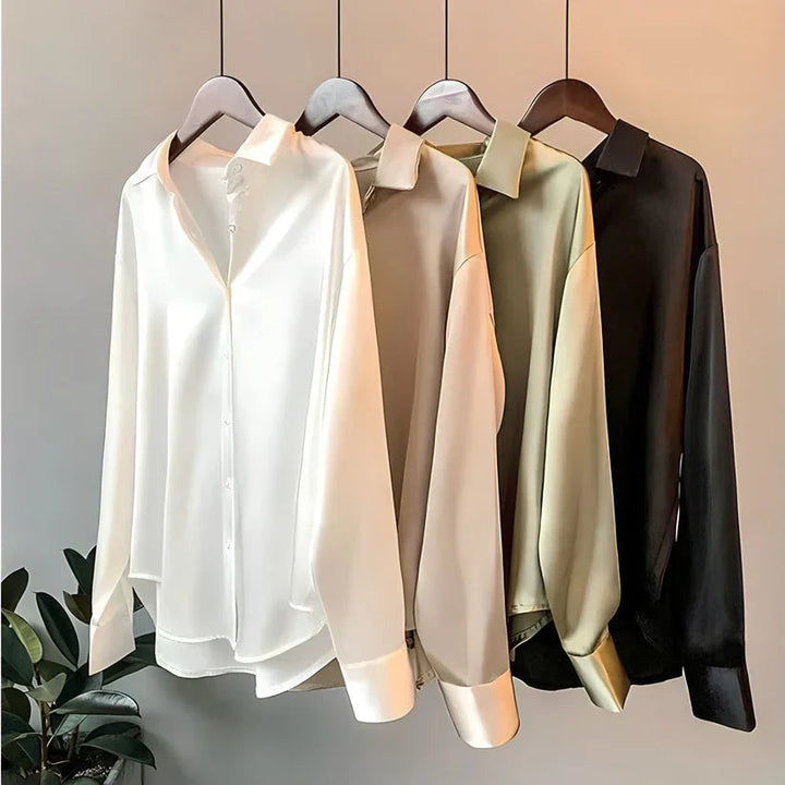 Blusa da donna maniche lunghe taglio fluido colletto classico orlo asimmetrico