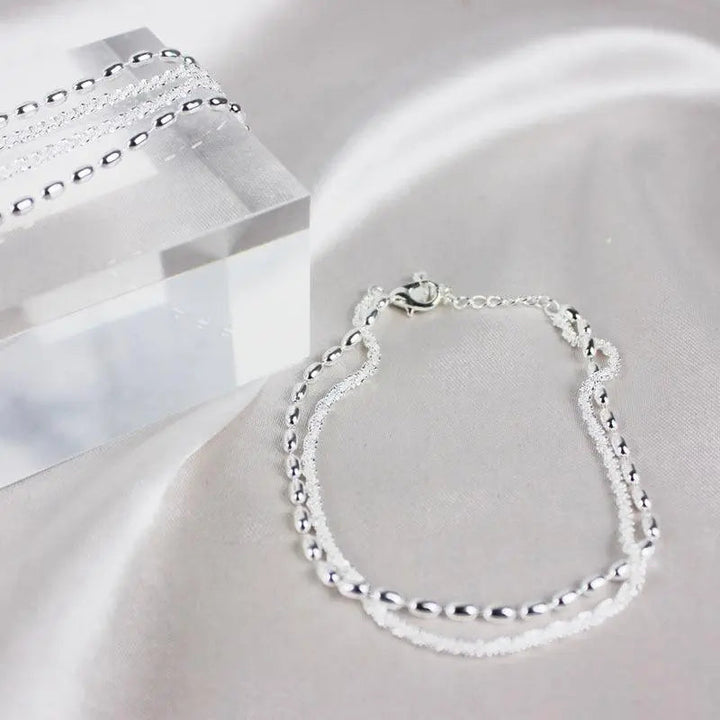 Set di bracciali eleganti in argento con pietre di zirconia