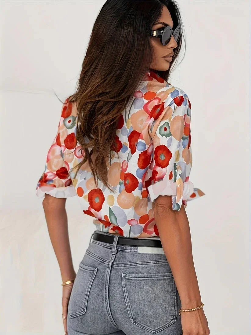 Blusa da donna colorata a motivi floreali con maniche lunghe