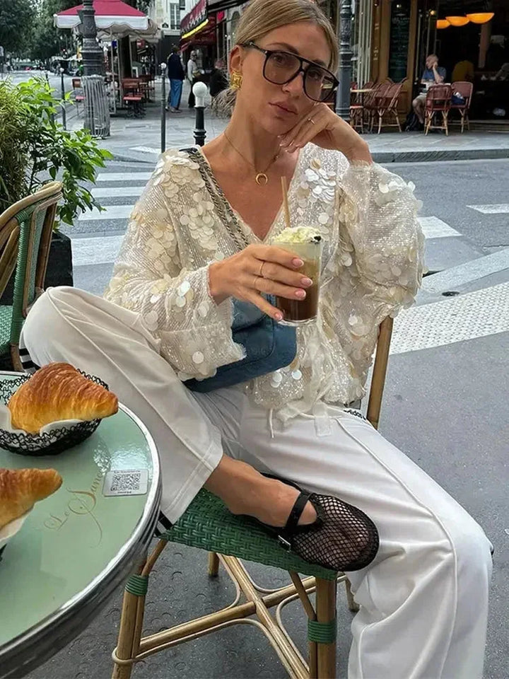 Blusa donna avorio con paillettes e scollo a V