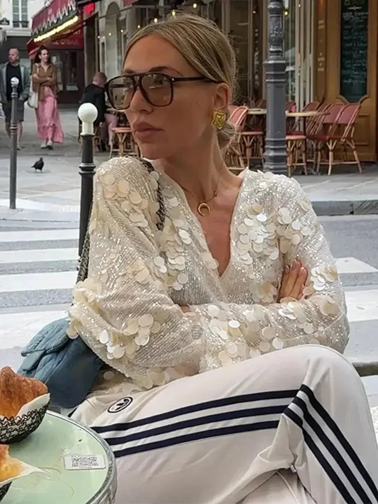 Blusa donna avorio con paillettes e scollo a V
