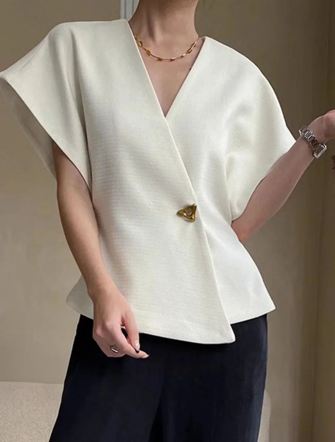 Blusa donna stile incrociato con maniche scolpite