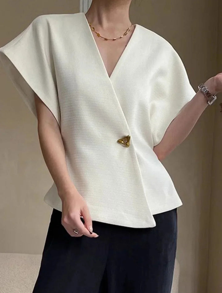 Blusa donna stile incrociato con maniche scolpite