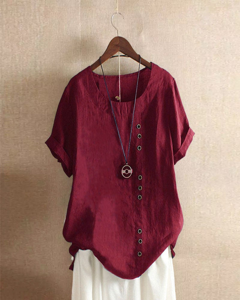 Blusa donna girocollo maniche corte risvoltate abbottonatura asimmetrica vestibilità ampia