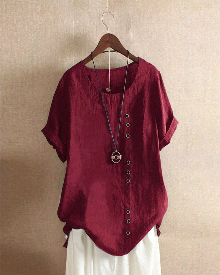 Blusa donna girocollo maniche corte risvoltate abbottonatura asimmetrica vestibilità ampia