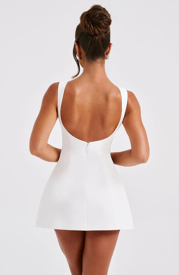 Vestito corto da donna con scollo a barca, schiena scoperta, gonna svasata, senza maniche, con tasche