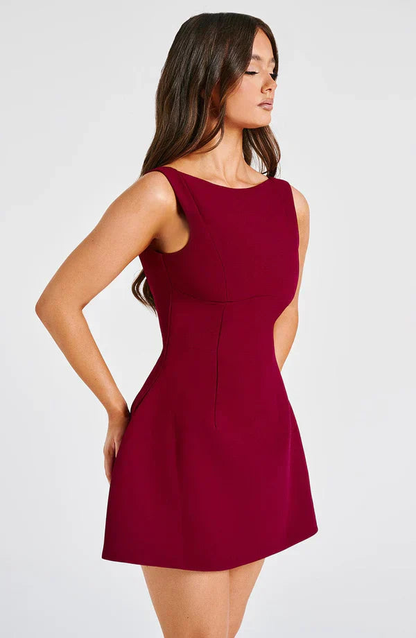 Vestito corto da donna con scollo a barca, schiena scoperta, gonna svasata, senza maniche, con tasche