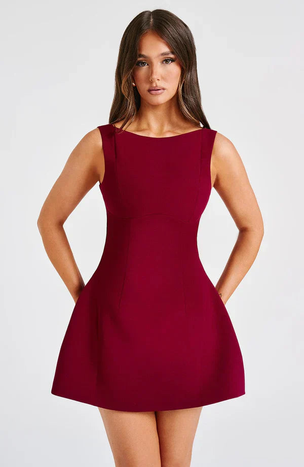 Vestito corto da donna con scollo a barca, schiena scoperta, gonna svasata, senza maniche, con tasche
