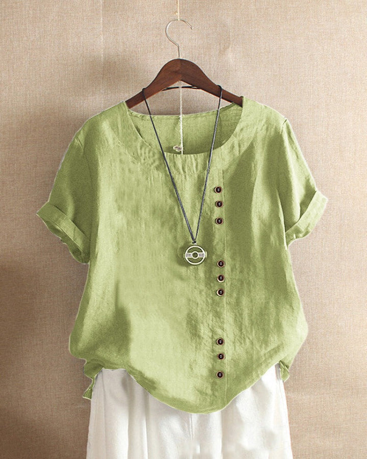 Blusa donna girocollo maniche corte risvoltate abbottonatura asimmetrica vestibilità ampia