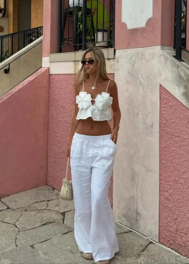 Top crop donna con applicazioni floreali e spalline sottili