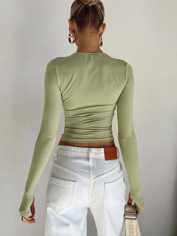 Top da donna a maniche lunghe elasticizzato dal design aderente