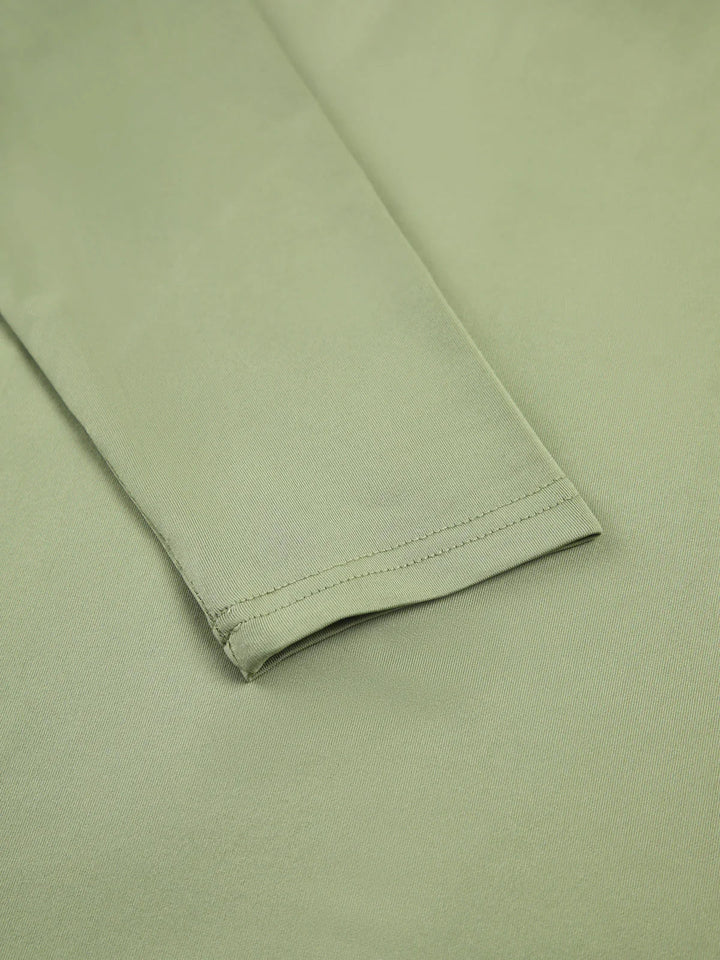 Top da donna a maniche lunghe elasticizzato dal design aderente