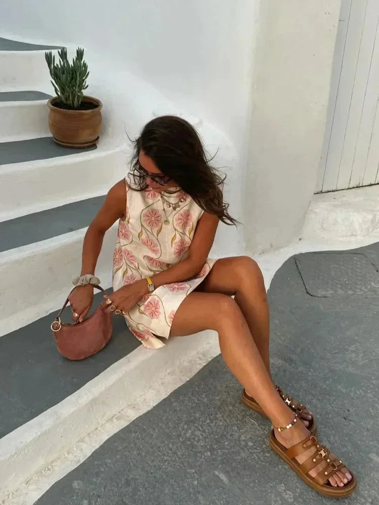 Vestito corto senza maniche bianco con motivi floreali rosa