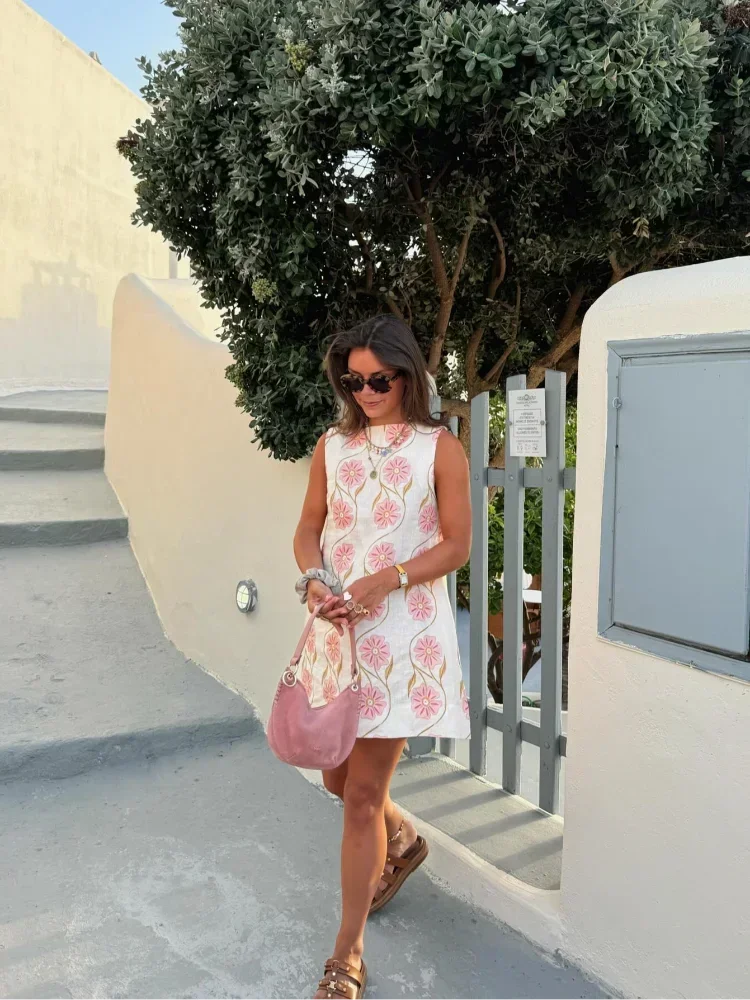 Vestito corto senza maniche bianco con motivi floreali rosa