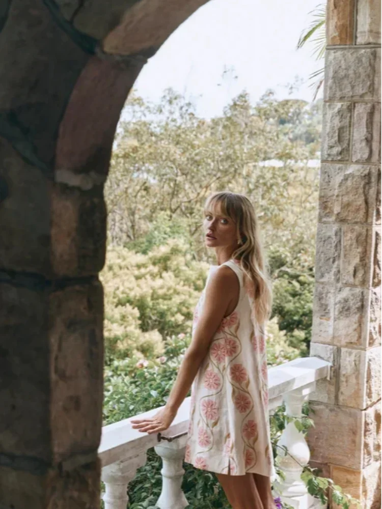 Vestito corto senza maniche bianco con motivi floreali rosa