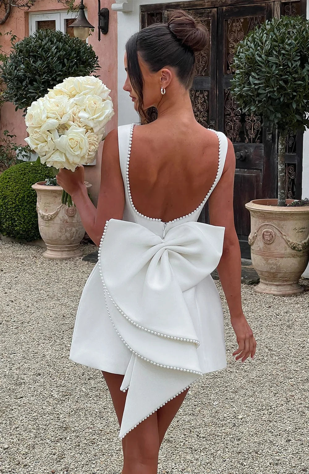 Vestito corto donna con fiocco decorativo sul retro