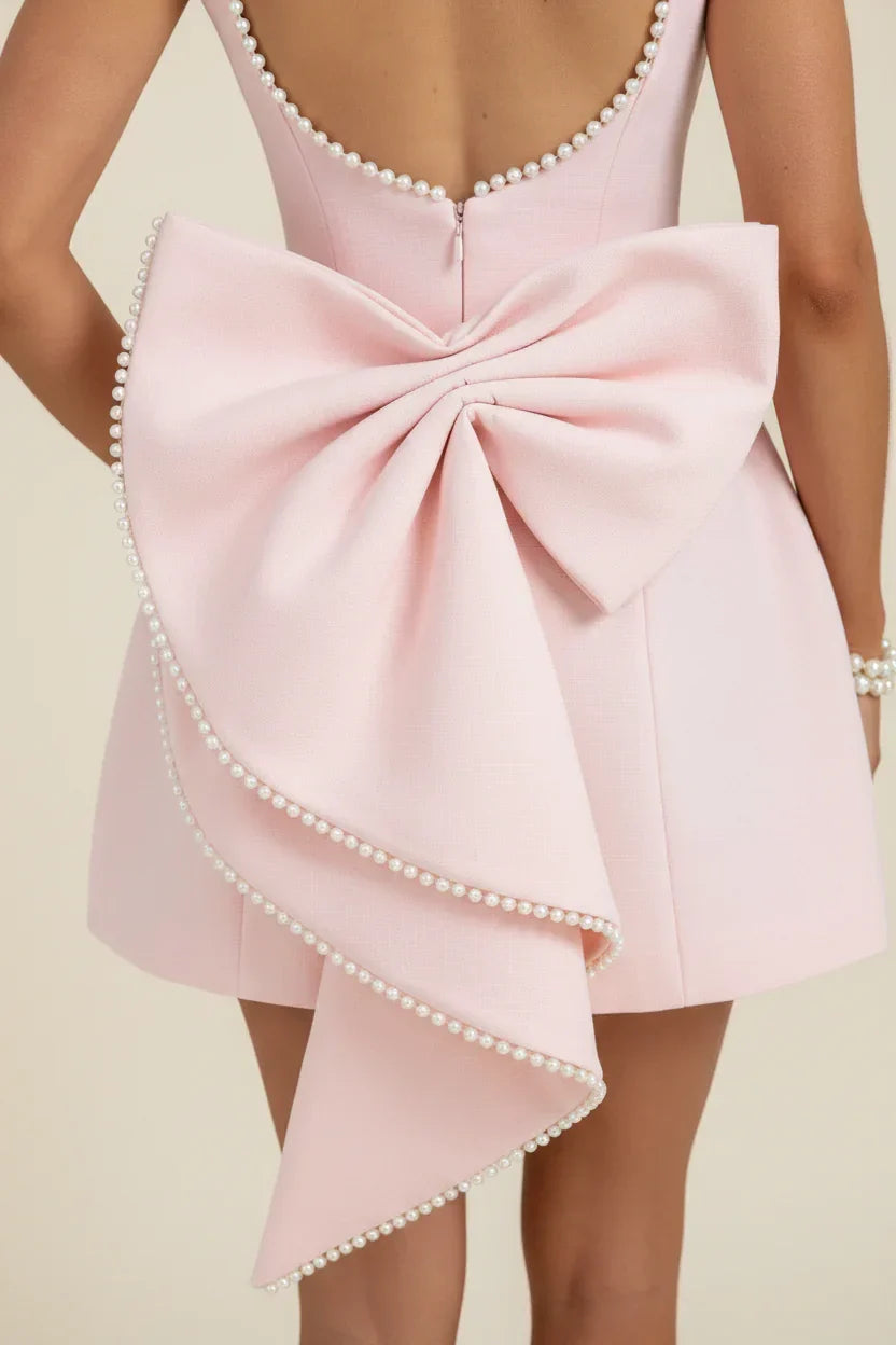 Vestito da sera da donna rosa con fiocco sulla schiena