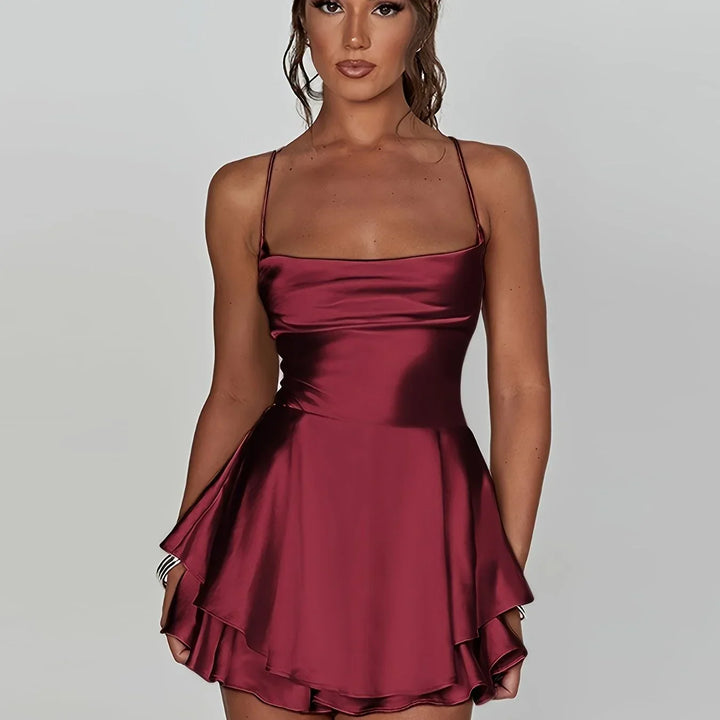 Vestito corto schiena nuda donna con spalline e gonna svasata