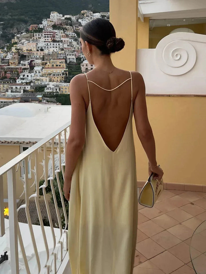 Vestito lungo schiena nuda giallo per estate spiaggia relax
