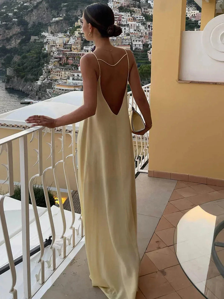 Vestito lungo schiena nuda giallo per estate spiaggia relax