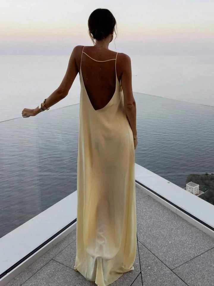 Vestito lungo schiena nuda giallo per estate spiaggia relax