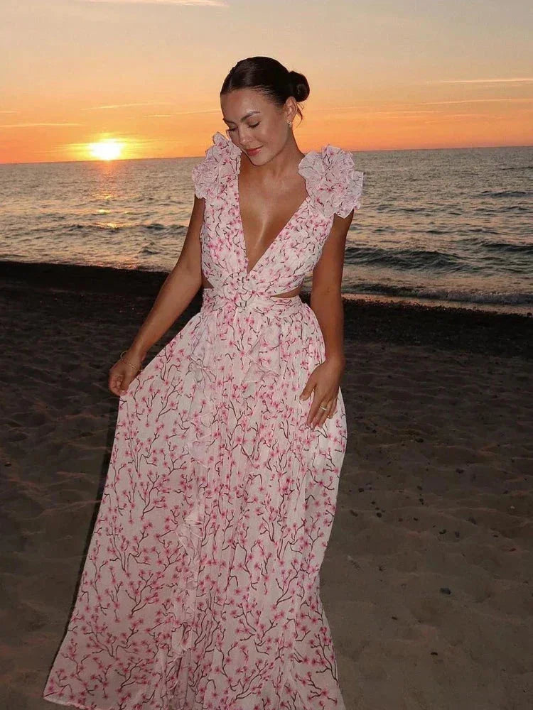 Vestito lungo rosa a fiori con volant, scollo a V incrociato