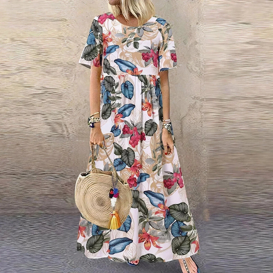 Vestito lungo con volant, motivo botanico e maniche corte
