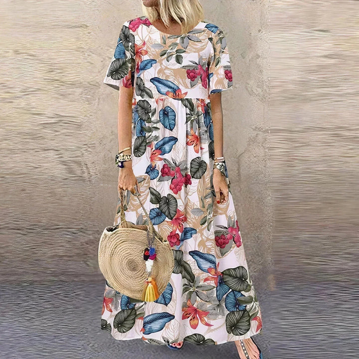 Vestito lungo con volant, motivo botanico e maniche corte