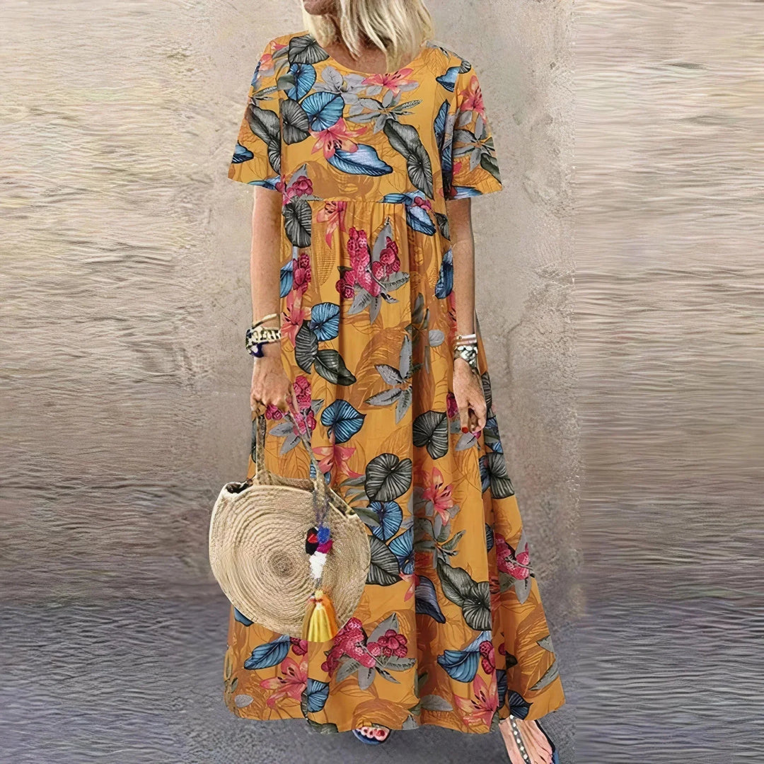 Vestito lungo con volant, motivo botanico e maniche corte