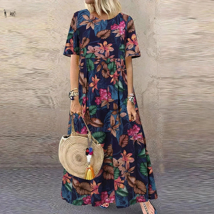 Vestito lungo con volant, motivo botanico e maniche corte