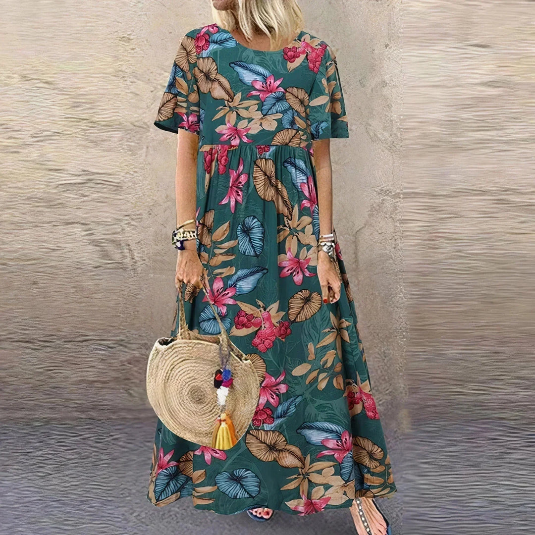Vestito lungo con volant, motivo botanico e maniche corte