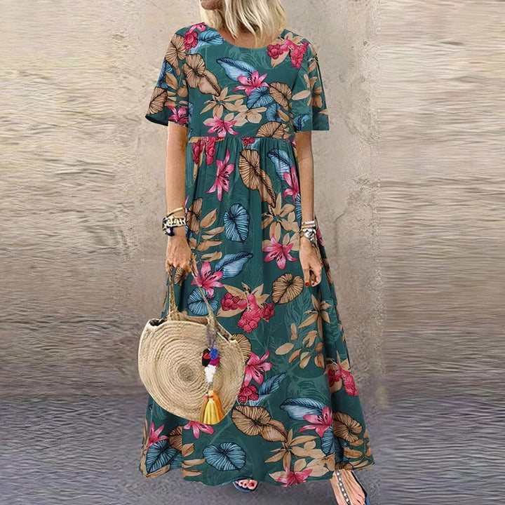 Vestito lungo con volant, motivo botanico e maniche corte