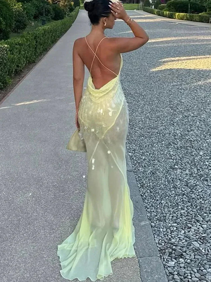 Vestito lungo giallo con paillettes, schiena incrociata, scollo a V