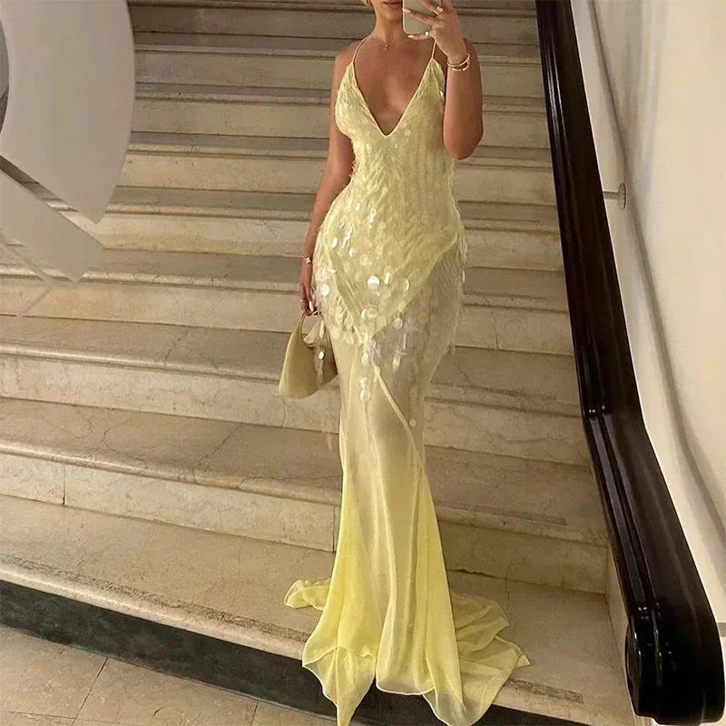 Vestito lungo giallo con paillettes, schiena incrociata, scollo a V