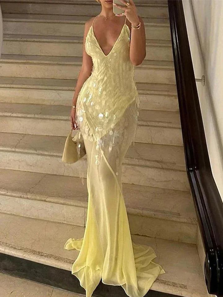 Vestito lungo giallo con paillettes, schiena incrociata, scollo a V