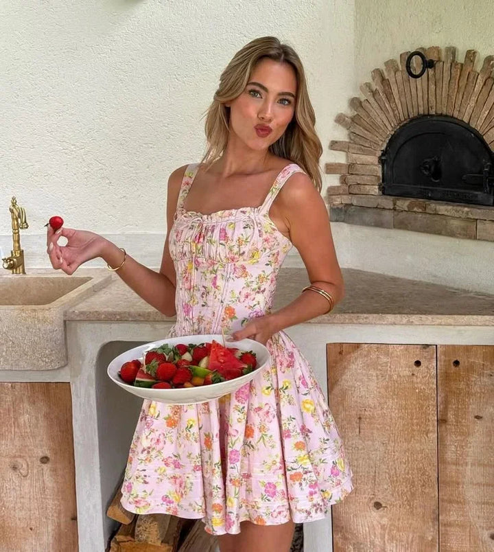 Vestito corto rosa a fiori con corsetto e spalline larghe
