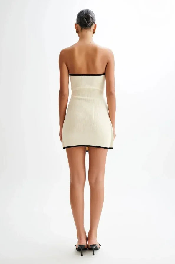 Vestito corto beige senza maniche bordi neri con fiocco
