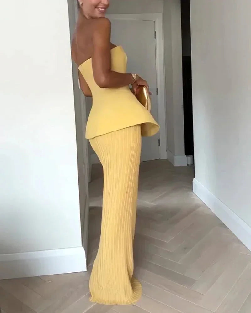 Completo bustier giallo con gonna a costine midi