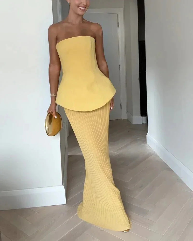 Completo bustier giallo con gonna a costine midi